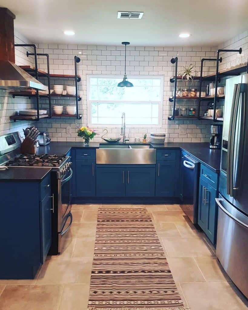 blue cabinet industrial style kitchen with white tiles 