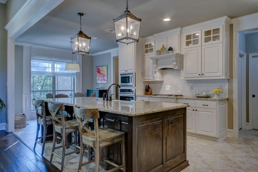 wood cabinet island in farmhouse kitchen 