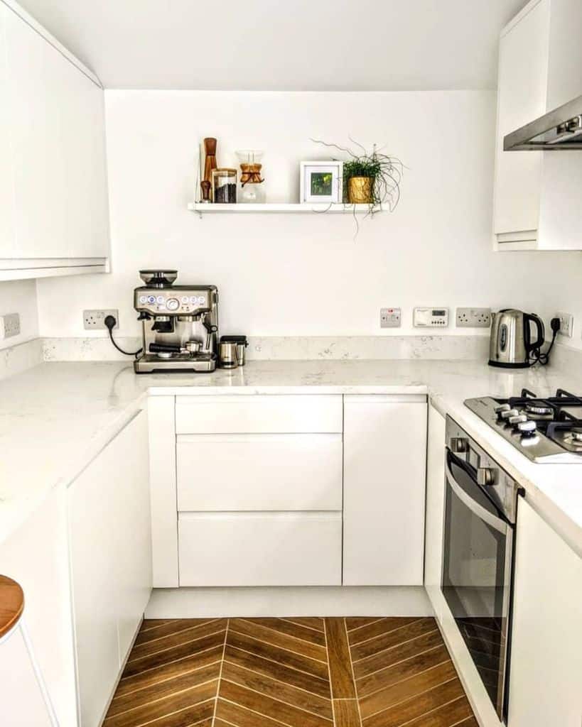 simple white cabinet kitchen marble countertop subway tile flooring 