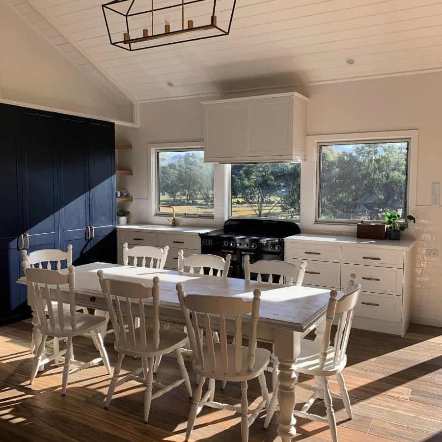 large open farmhouse kitchen with blue and white cabinets 