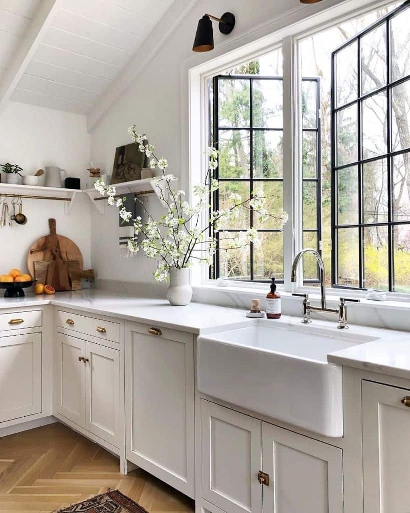 spacious white cabinet farmhouse kitchen with open window 