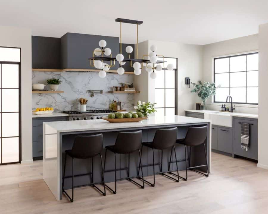 open gray cabinets kitchen with island and sputnik chandelier