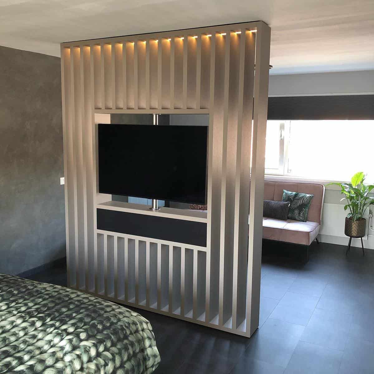 wall divider with mounted tv in bedroom 