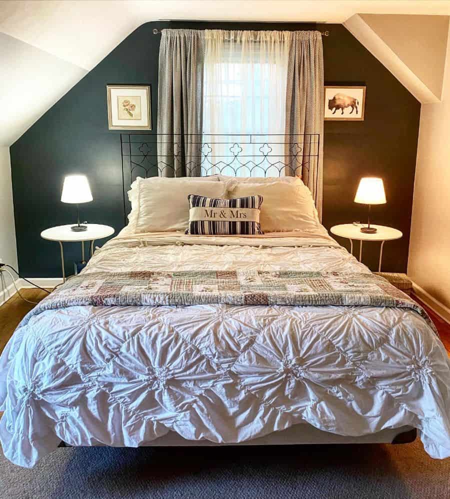 attic small master bedroom with black accent wall 