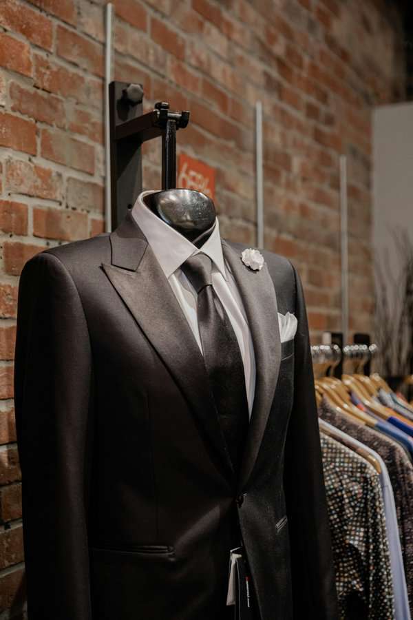 A groom's tuxedo on a mannequin rack