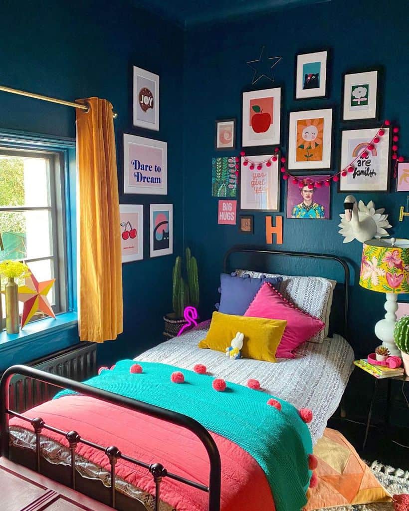 Small blue bedroom with inspiring wall art, colorful bedding, and vibrant decor.