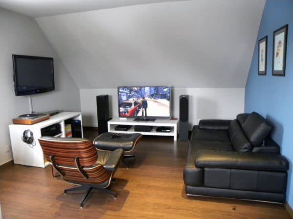 Cozy gaming room with leather seating, TV on a console, and video game displayed on screen