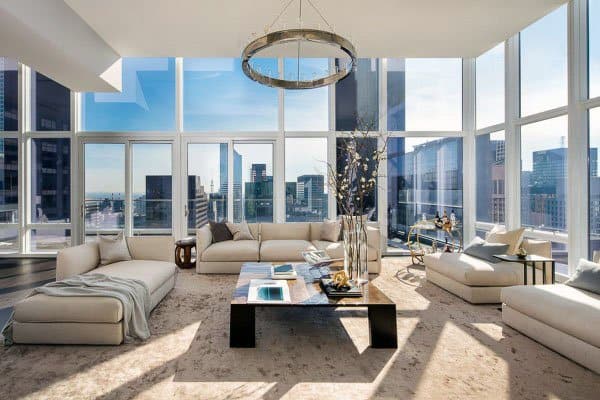 modern apartment living room with ceiling to floor windows 