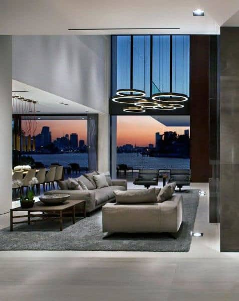 luxury grey living room grey couches city river view abstract lighting 