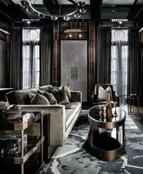 Luxurious living room featuring a velvet sofa, metallic accents, and a sleek coffee table in dim lighting