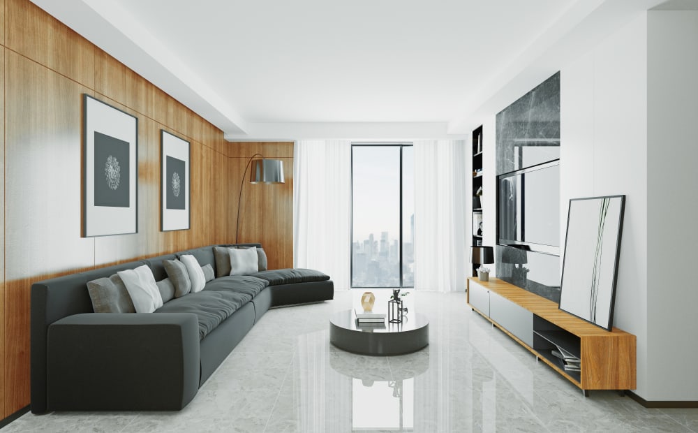 Elegant living room with a sleek black sofa, wood-paneled walls, marble flooring, and a city skyline view.