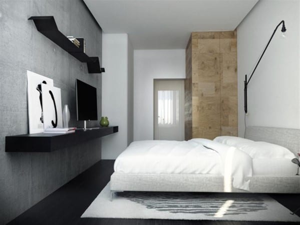 Minimalist boho bedroom with concrete accent wall, floating shelves, and neutral bedding.