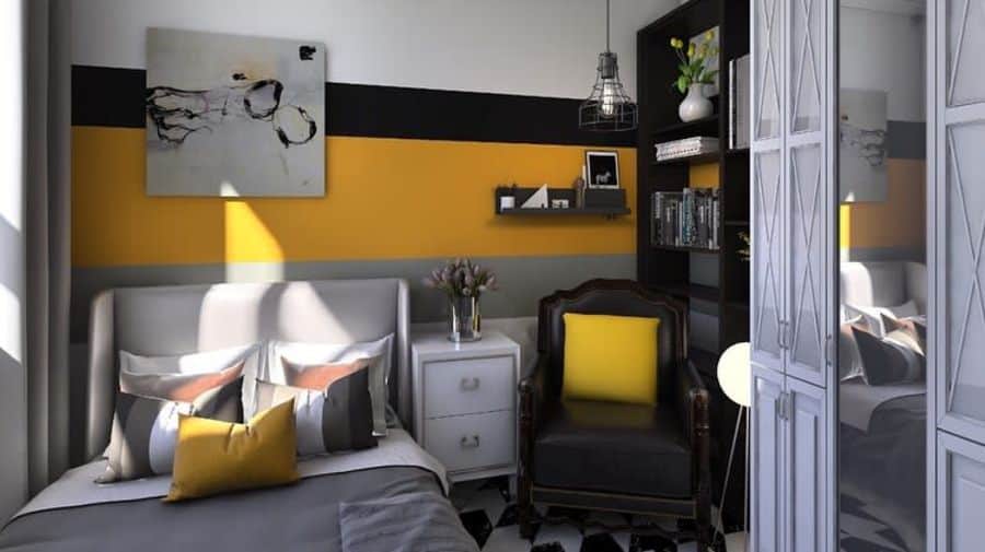 Small bedroom with colorful wall stripes, leather chair, and black bookcase.