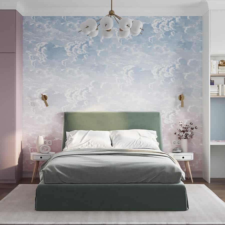 Modern bedroom with sky mural wallpaper, green bed, and elegant lighting fixtures.