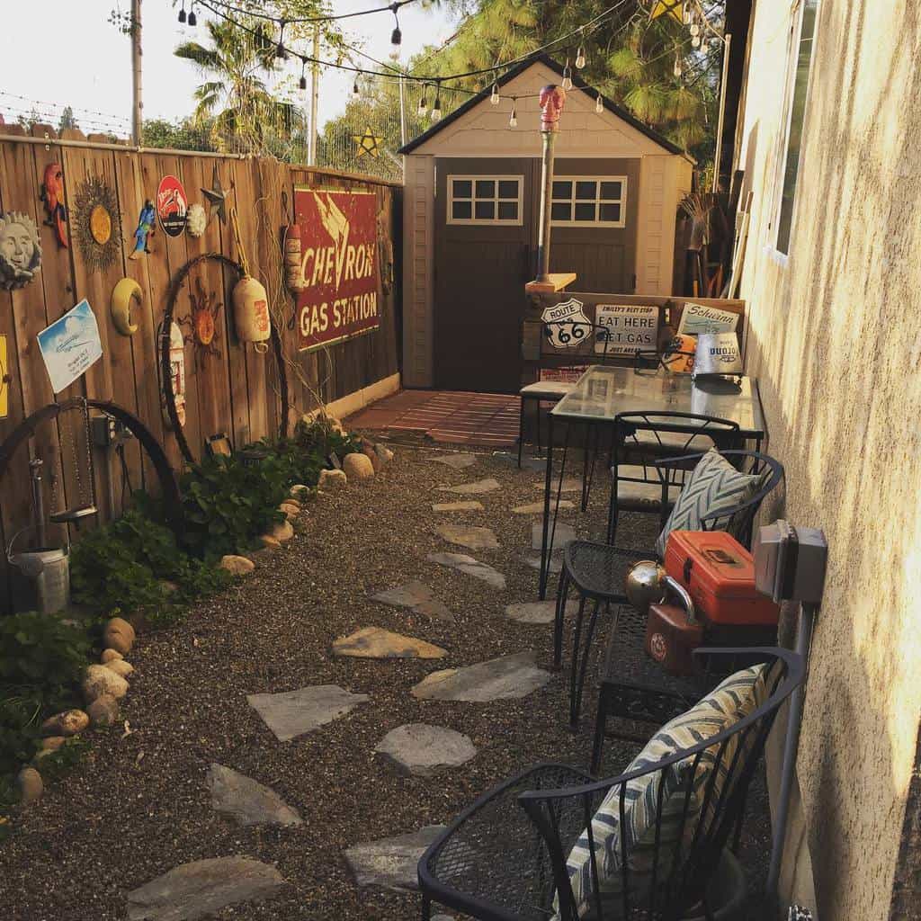 narrow backyard with shed and outdoor furniture 