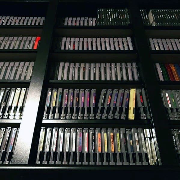 Shelves filled with vintage game cartridges arranged neatly in rows