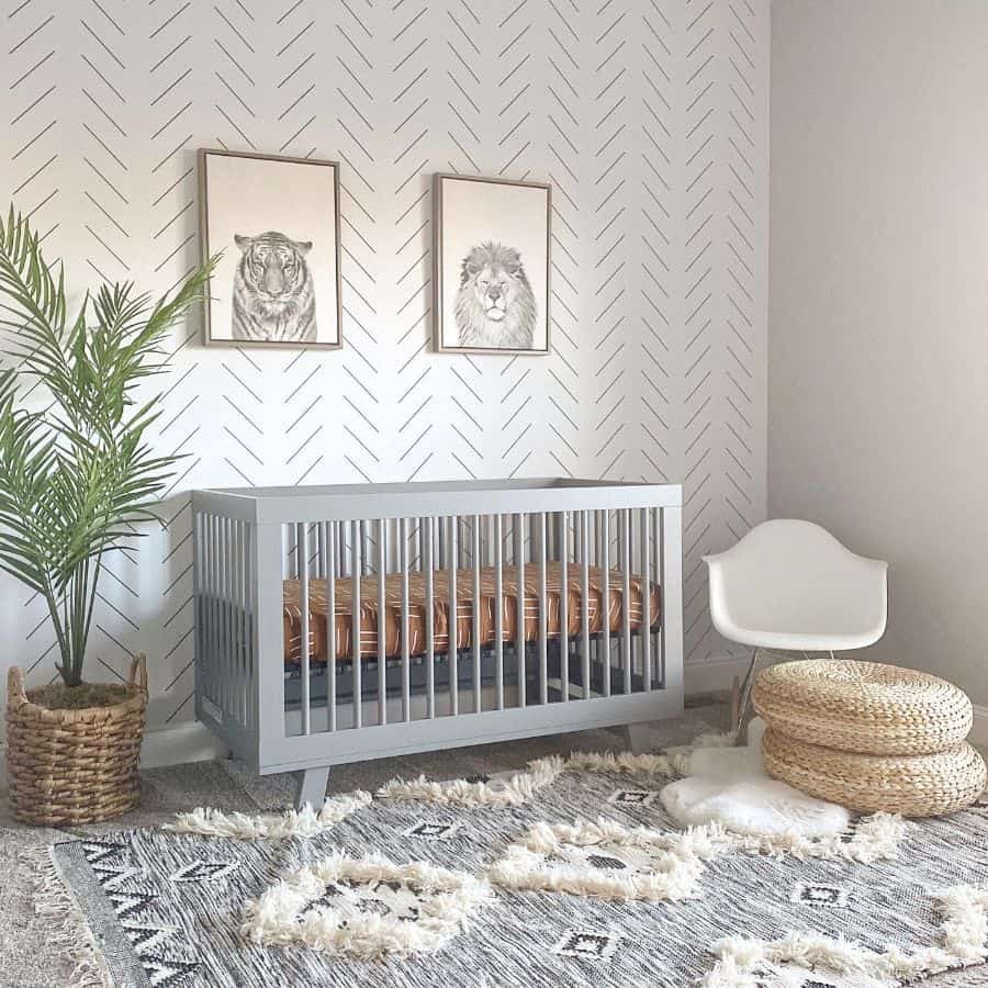 Modern baby room with grey crib, geometric wall art, and textured rug with woven accents.