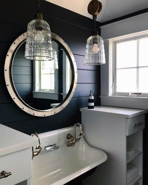 nautical theme powder room with mirror