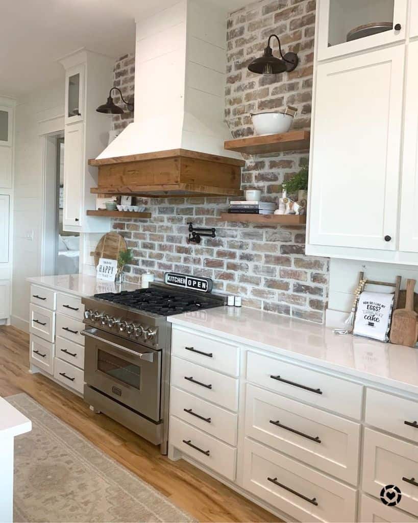 brick backsplash white cabinets rustic kitchen 