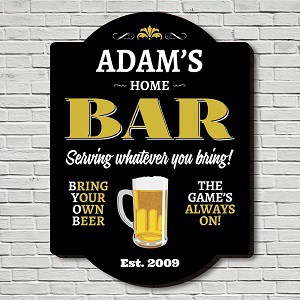 Personalized home bar sign with beer mug graphic and playful text on a black background.