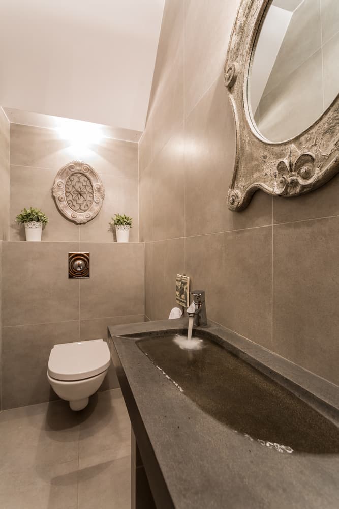 gray slate powder room with unique sink 