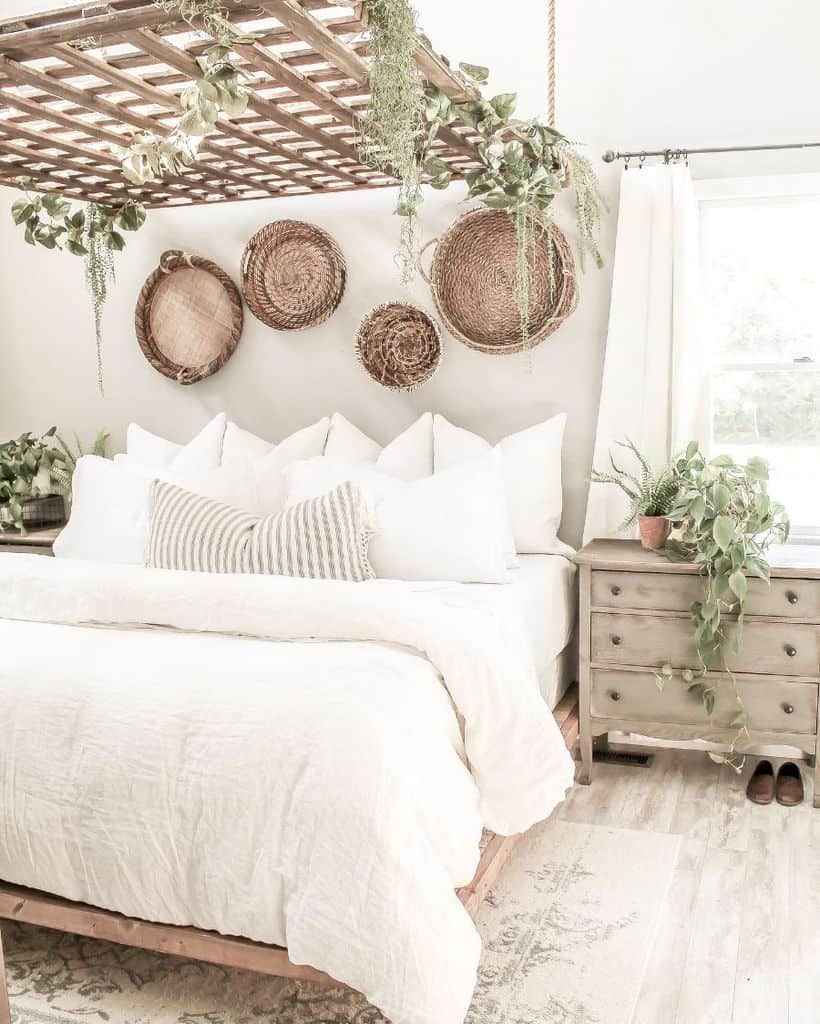 Colorful bedroom with tassel garland, vibrant bedding, decorative pillows, and wall art.