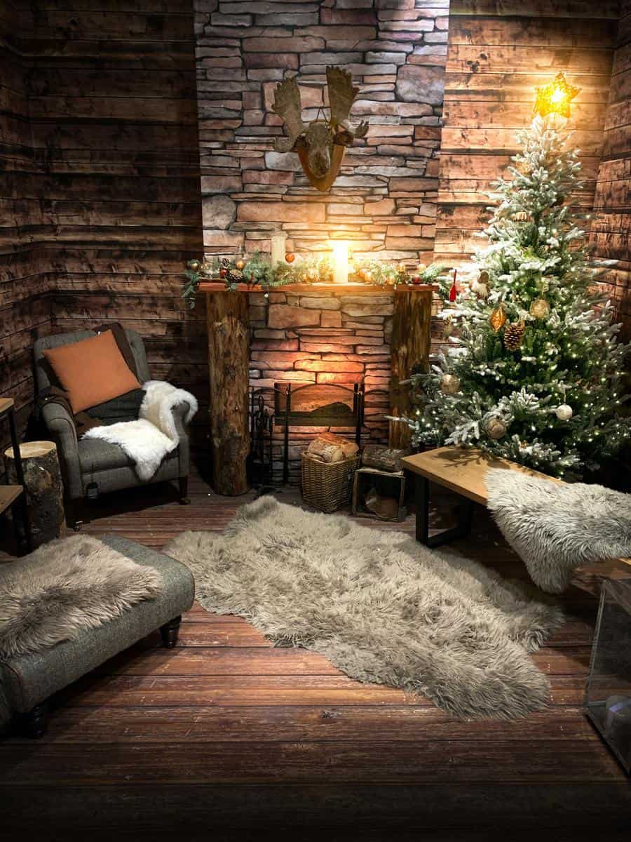 Cozy rustic room with brown fur rugs, fireplace, decorated Christmas tree, and a comfy armchair with a throw blanket