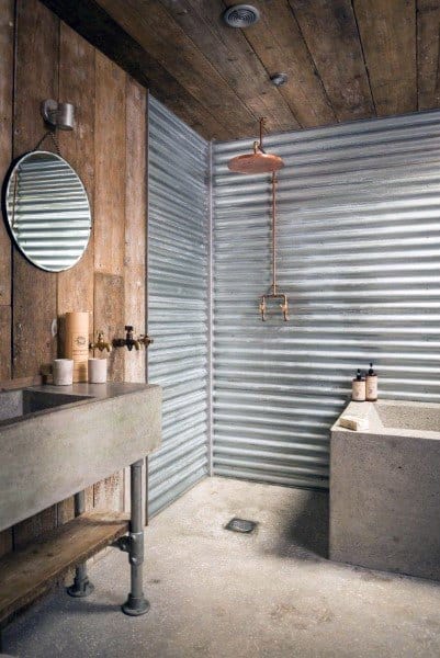 Rustic bathroom with metal walls, concrete sink, and charming wood accents