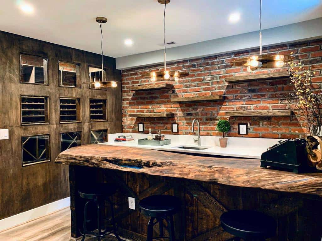 Rustic wet bar with live edge wood countertop, brick accent wall, wine storage, and pendant lighting.