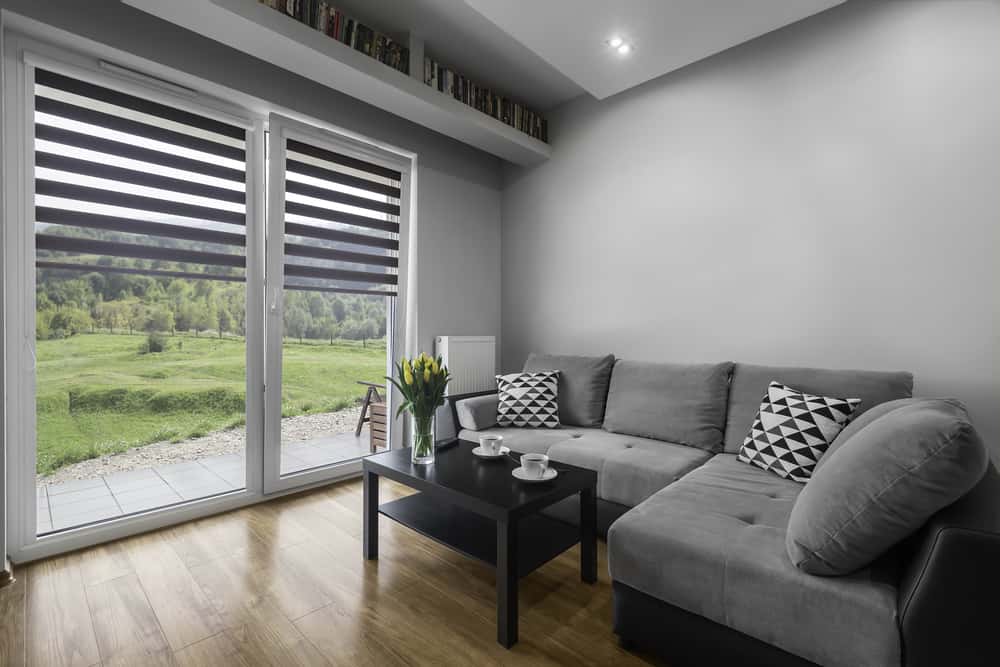 gray living room couch and shades black coffee table 