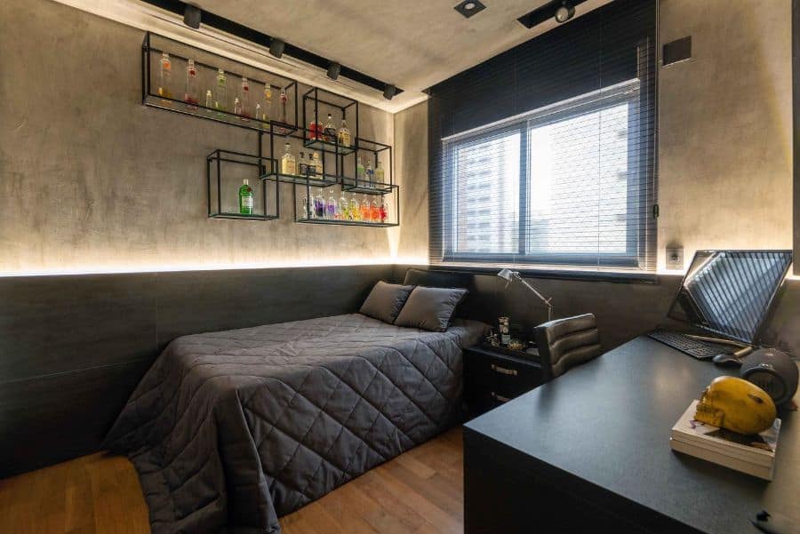 Contemporary bedroom with spirits wall rack, black desk, and gray bedding.