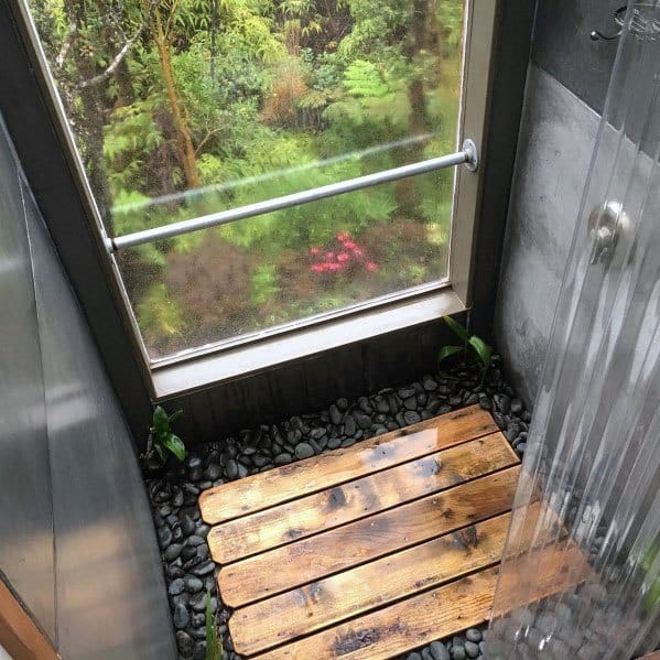 modern small shower with wood floor