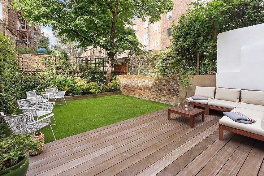 stylish backyard with lave area and wood deck