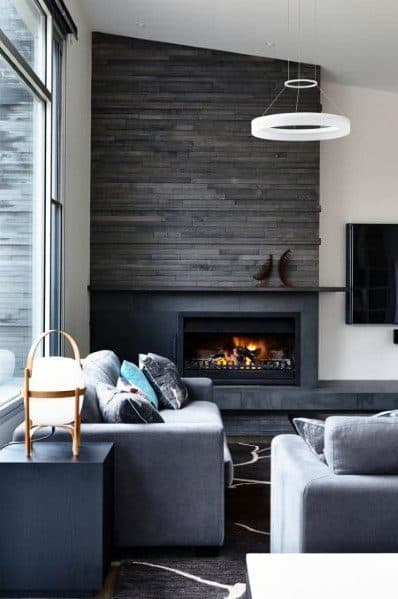 A contemporary living room with a sleek slate-tiled fireplace, adding depth and warmth to the modern space.