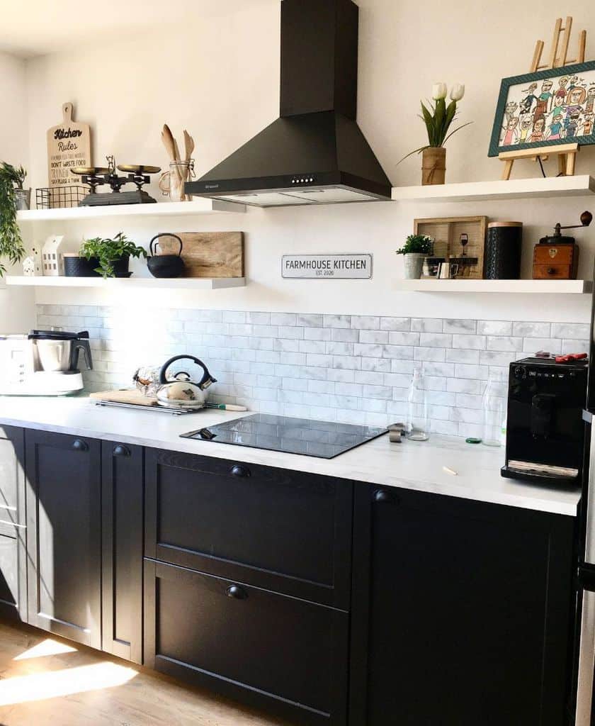 small black cabinet kitchen with white tile backsplash 