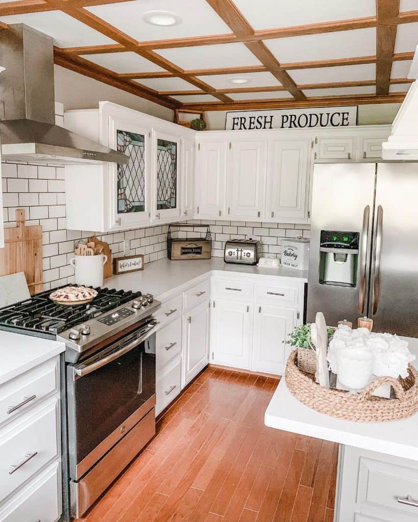 small white cabinet kitchen with white tile backsplash 