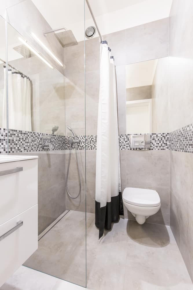 gray tile bathroom with mosaic wall tiles 