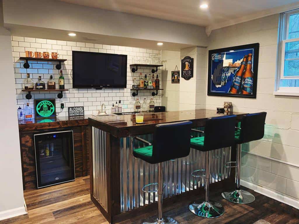 Industrial-style wet bar with corrugated metal, dark wood accents, and a white subway tile backsplash.