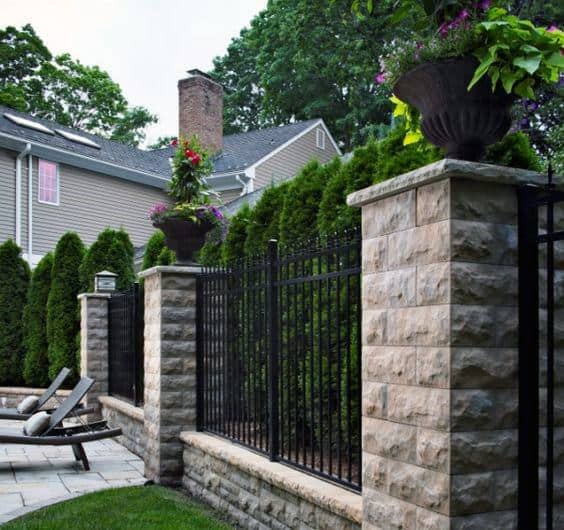 stone and metal fence 