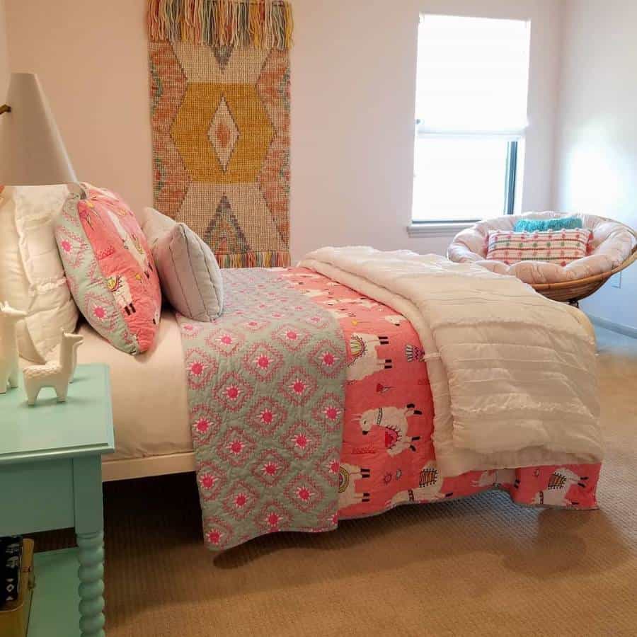 Colorful teen bedroom with patterned bedding, woven wall decor, and cozy seating.