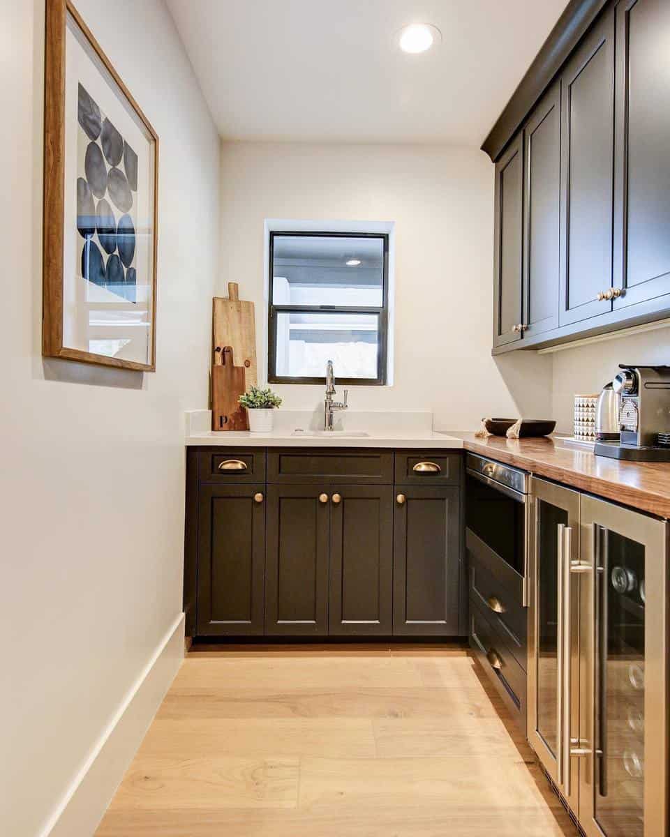 small kitchen gray cabinets white walls 