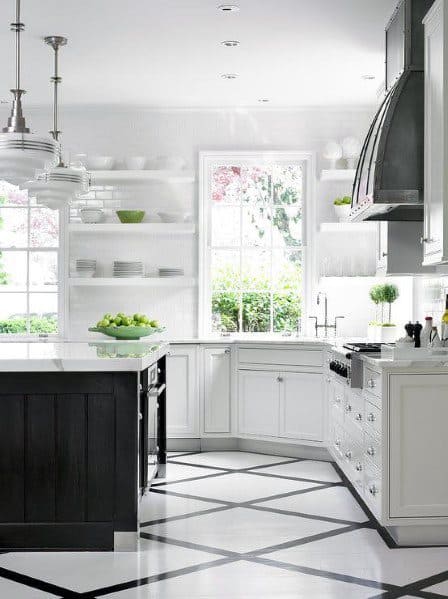 Bright kitchen with black and white geometric tile flooring, white cabinetry, and open shelving