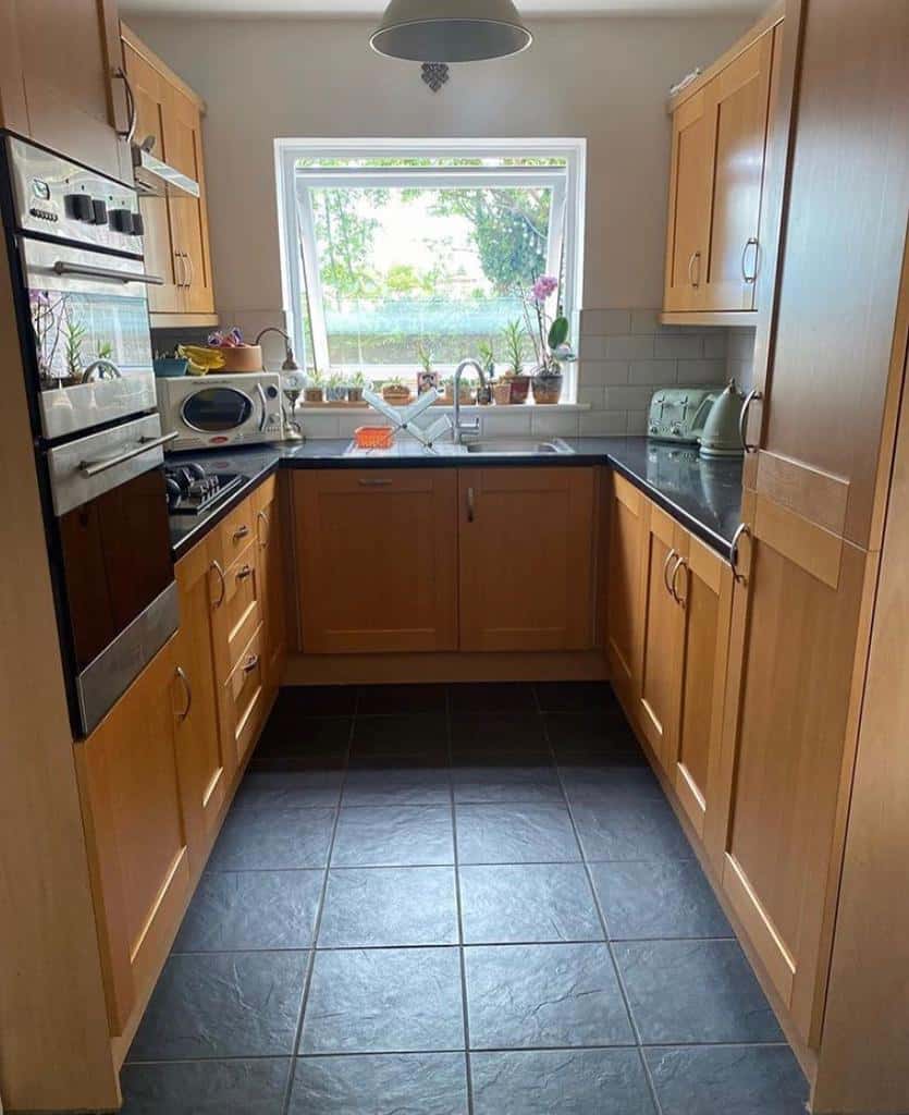 stained wood cabinets in small u-shape kitchen 