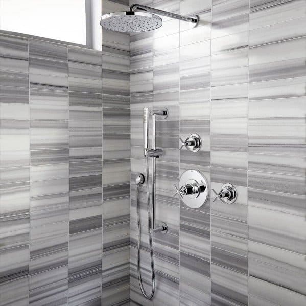 Modern shower with gray striped tiles and chrome fixtures