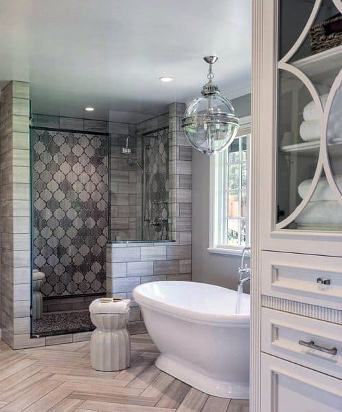 shower and white tub in master bathroom 