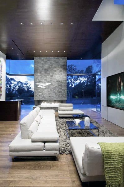 modern tv room with white sofas and fireplace 