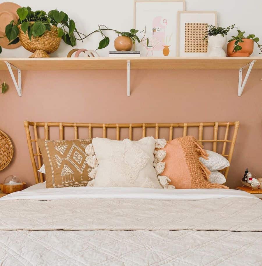 Warm boho bedroom with earthy tones, layered textures, and greenery accents.