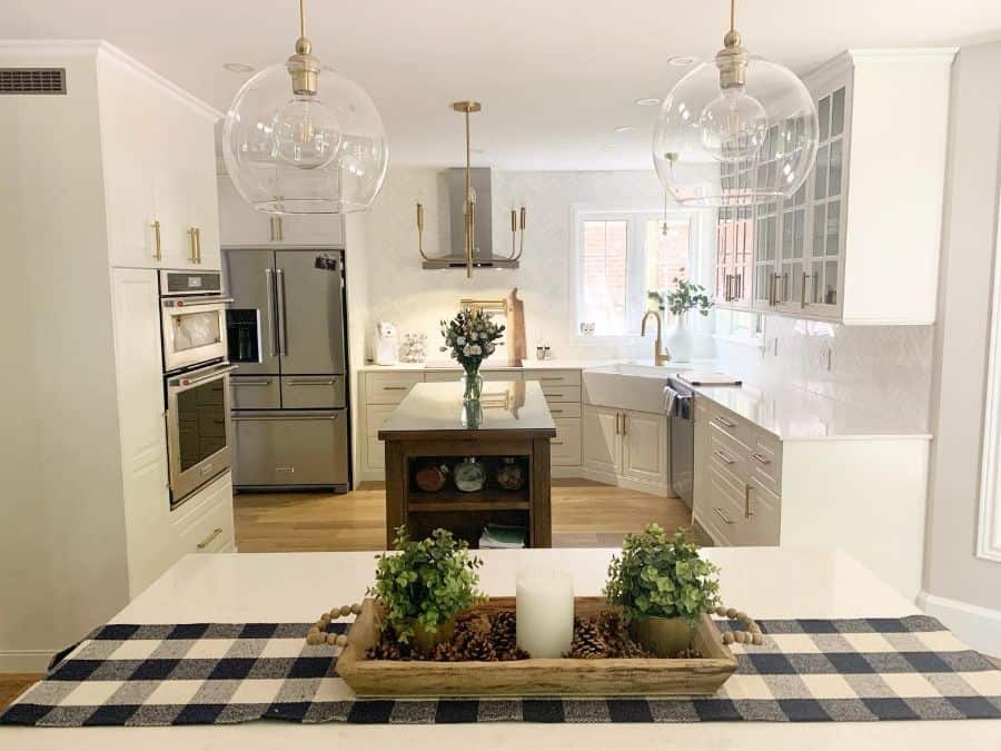 large white cabinet kitchen with gold accents 