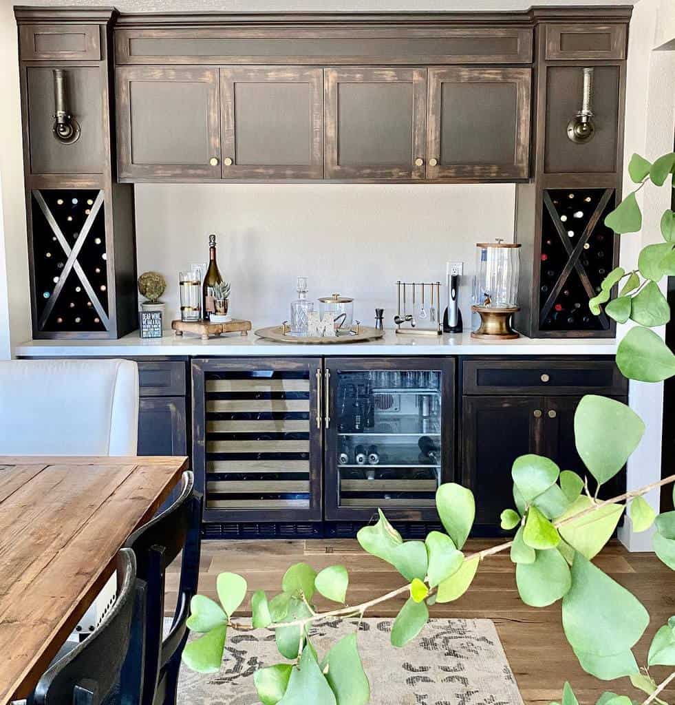 Chic wet bar with dark cabinetry, built-in wine racks, and dual beverage coolers for a functional yet stylish space.