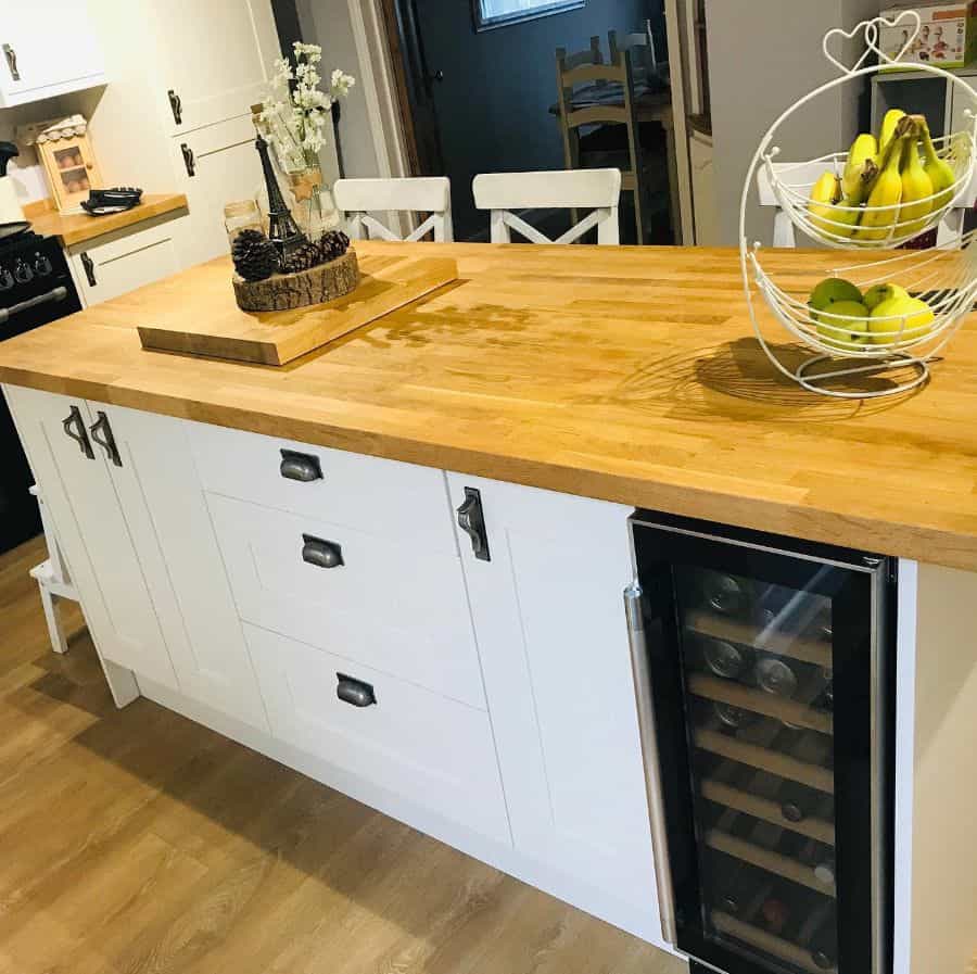 white kitchen cabinets wood bar wine fridge 